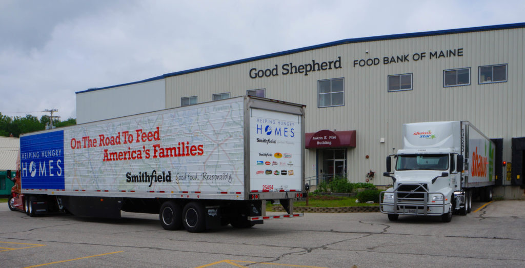 Smithfield food and Shaw's trucks deliver at the Auburn warehouse.
